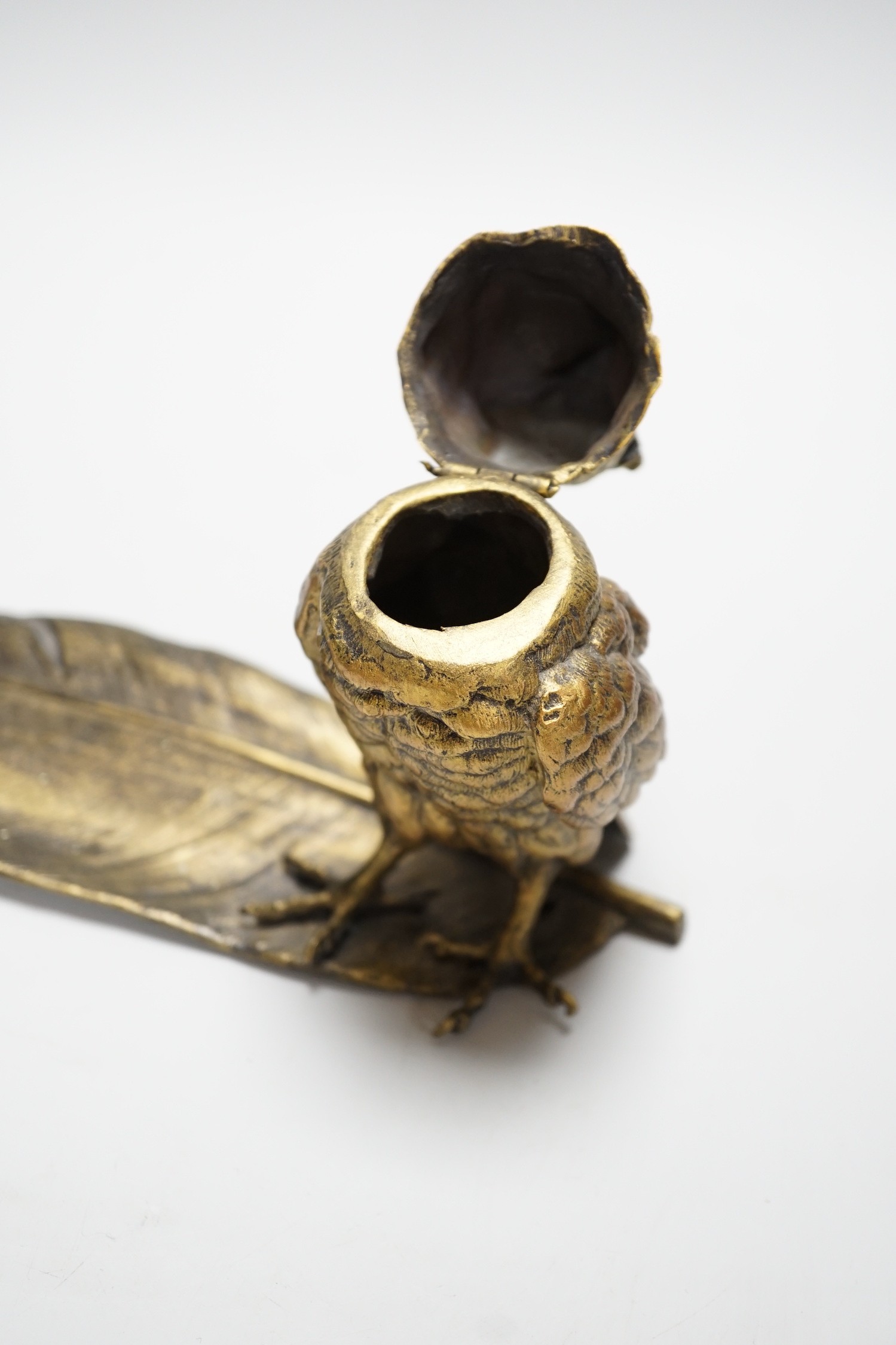 A bronze ‘owl and a feather’ inkwell with Bergman mark, 34cm long